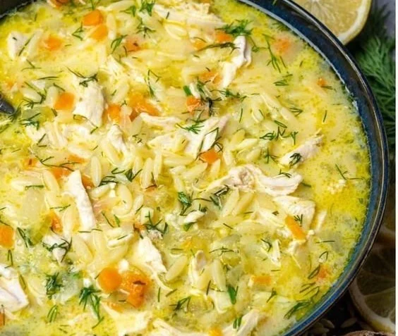 Bowl of Avgolemono, traditional Greek lemon chicken soup with fresh herbs