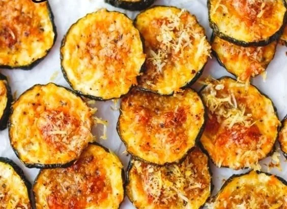 Homemade baked zucchini chips on a cutting board