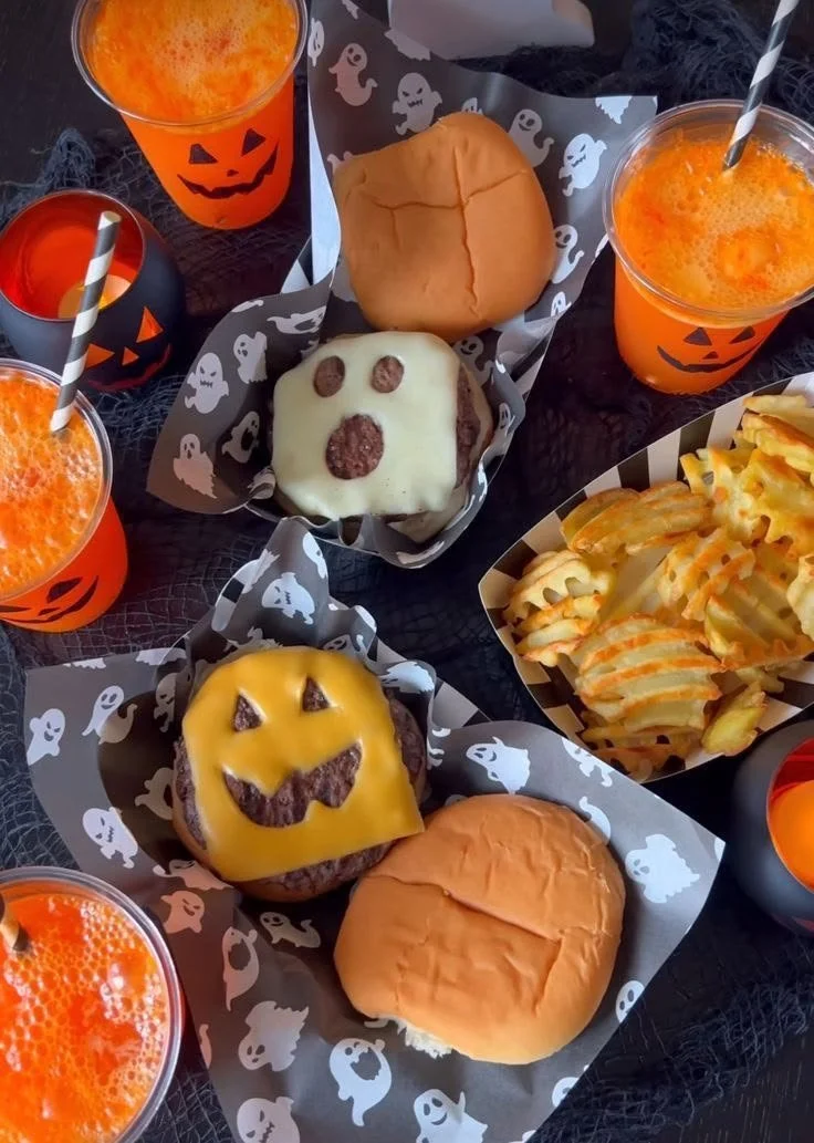 Juicy burgers with fresh toppings and condiments on a grill