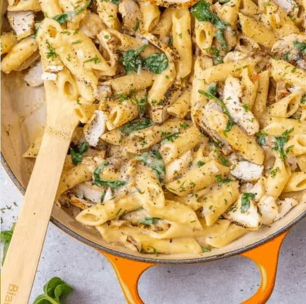 Savory Chicken Spinach Pasta served in a bowl with fresh ingredients
