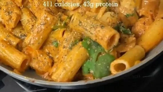 Creamy chicken pasta dish with fresh ingredients and a rich sauce