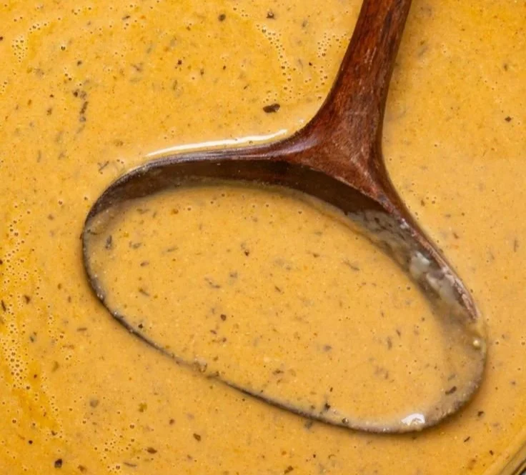 Delicious creamy roasted apple pumpkin soup served in a bowl.