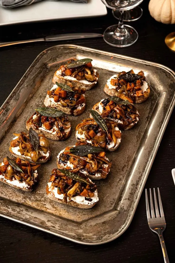Gothic dinner party menu featuring elegant, dark-themed food and appetizers.