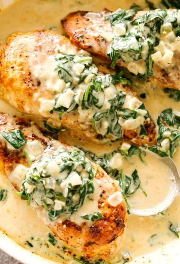 Easy chicken breasts recipe with creamy spinach sauce on a plate