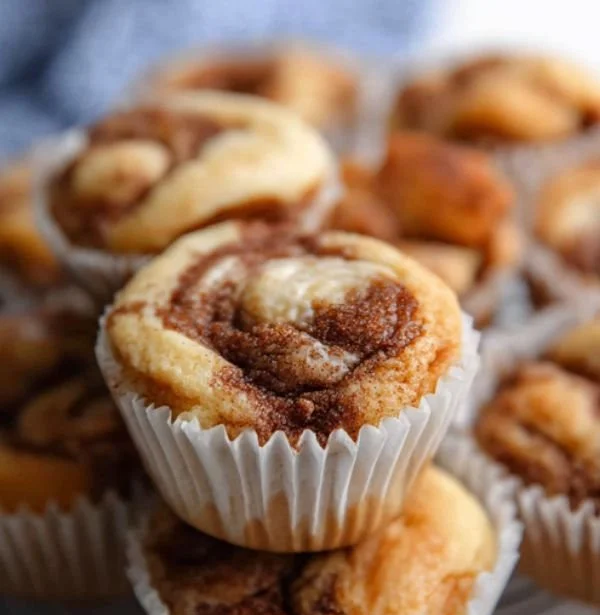 Delicious easy cinnamon protein muffins on a wooden table