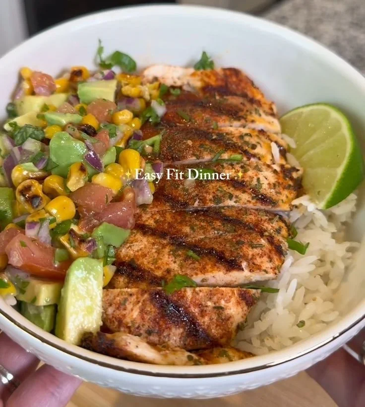 A colorful plate of easy healthy dinner options including grilled chicken and vegetables.