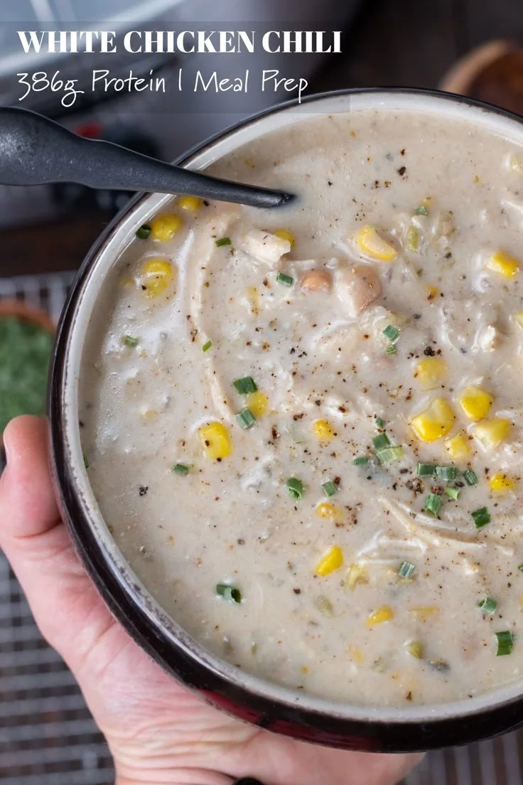 Bowl of easy white chicken chili topped with cilantro and lime.