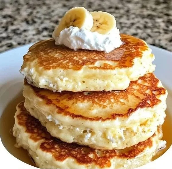 Fluffy banana pancakes made with cottage cheese served on a plate