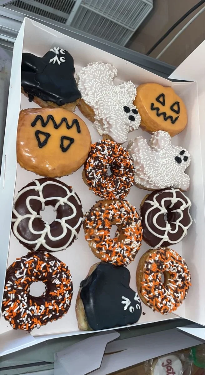 Delicious Halloween donuts decorated with spooky designs and colors