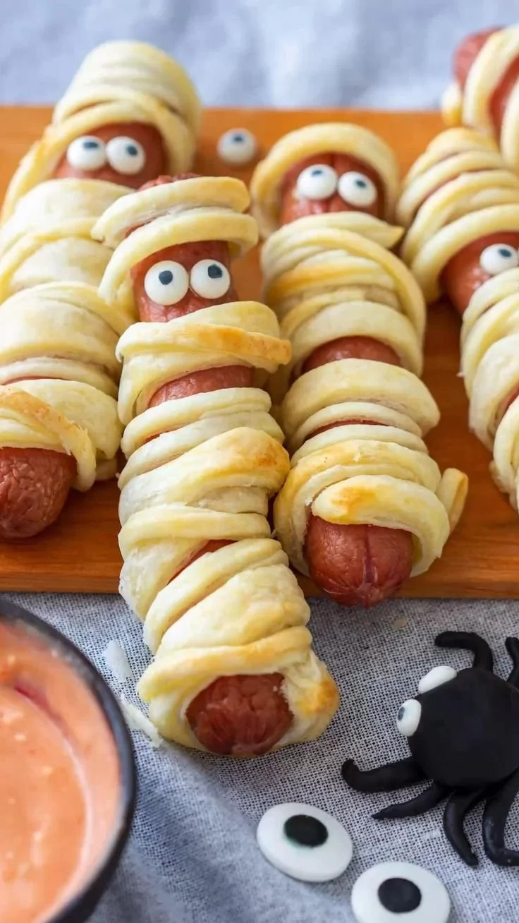 A platter of creepy Halloween finger food and appetizers for a festive party.