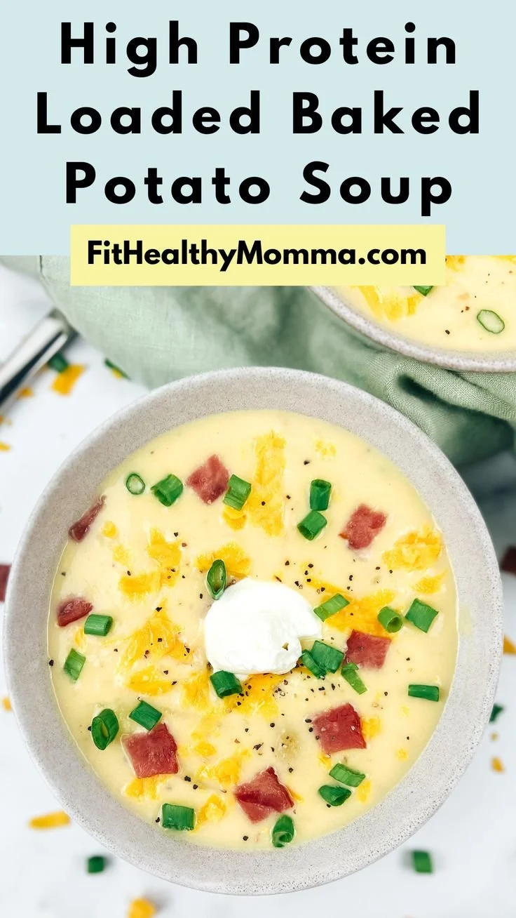 High protein loaded baked potato soup in a bowl, garnished with herbs.