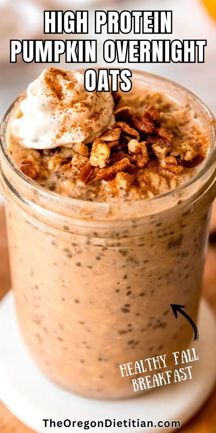 Bowl of high protein pumpkin overnight oats topped with nuts and seeds