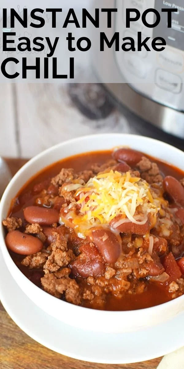 Bowl of hearty Instant Pot chili garnished with fresh herbs.