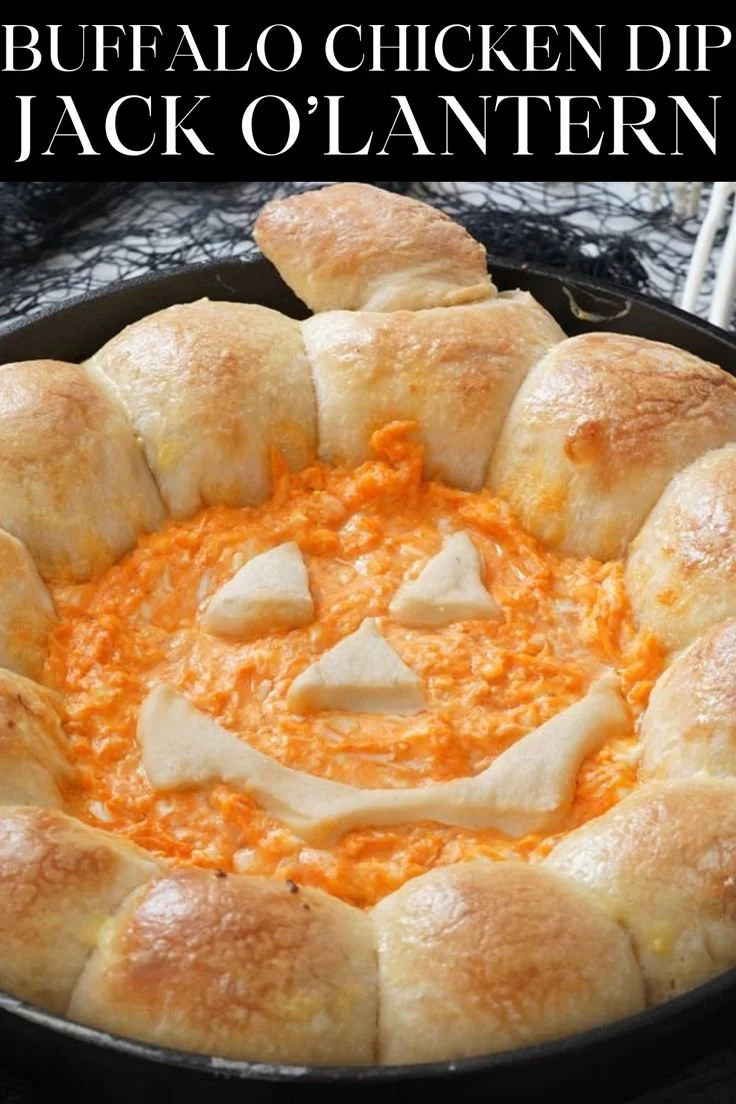 Jack O’Lantern Buffalo Chicken Dip served in a carved pumpkin for Halloween