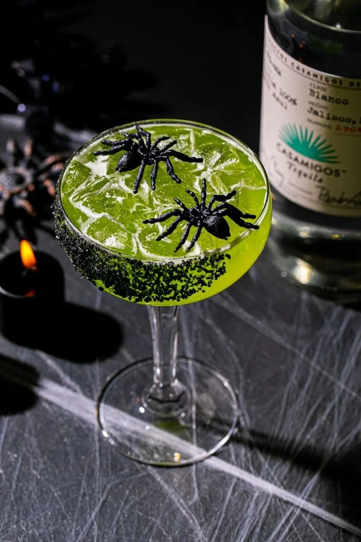 Colorful Halloween cocktails served in spooky glasses for festive gatherings