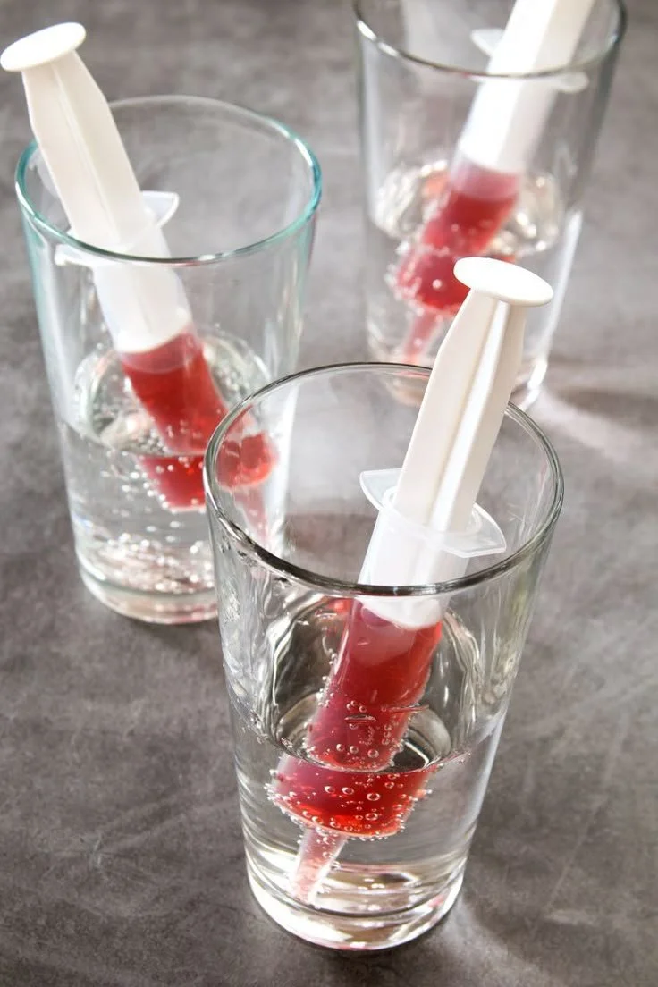 Halloween vodka cranberry syringe shot for a festive party