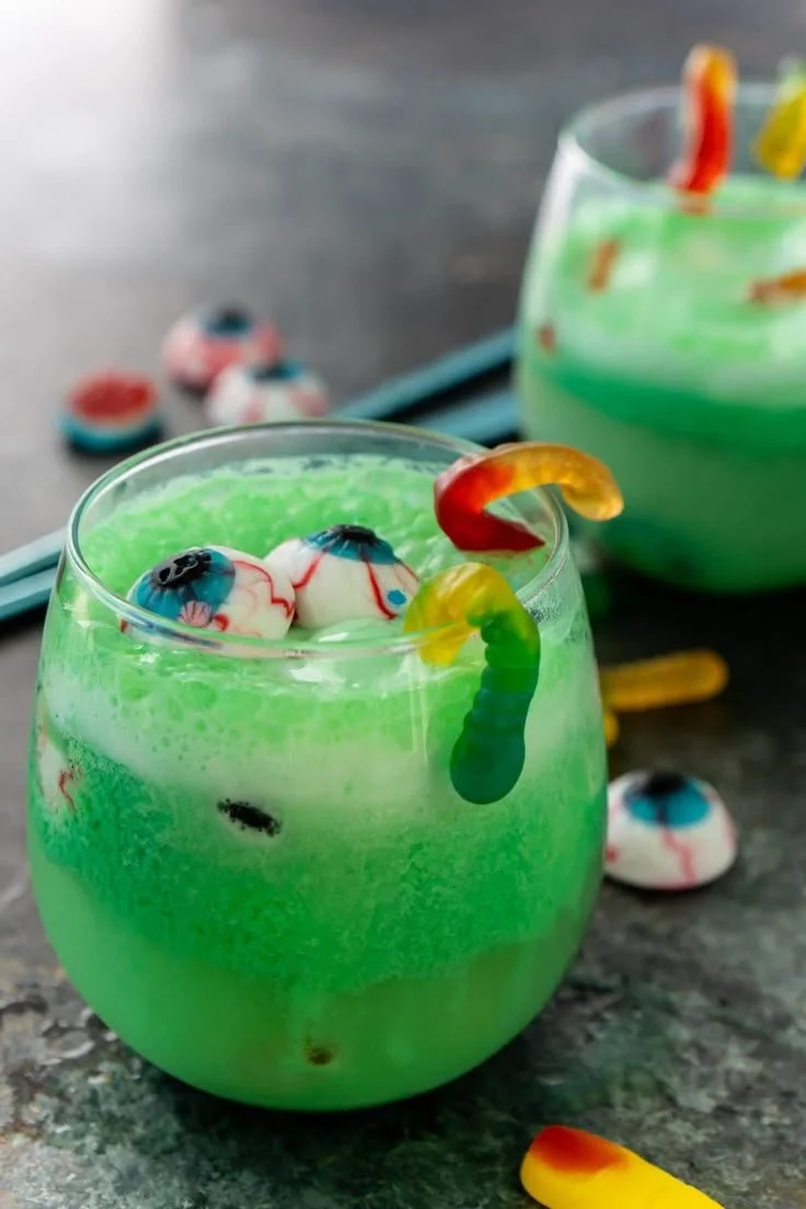 Zombie Halloween Punch in a spooky glass with decorative garnishes