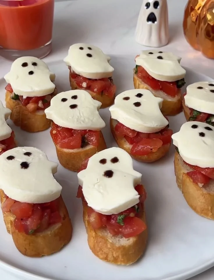 Halloween snacks featuring Beetlejuice inspired treats and Caprese crostini ghosts.