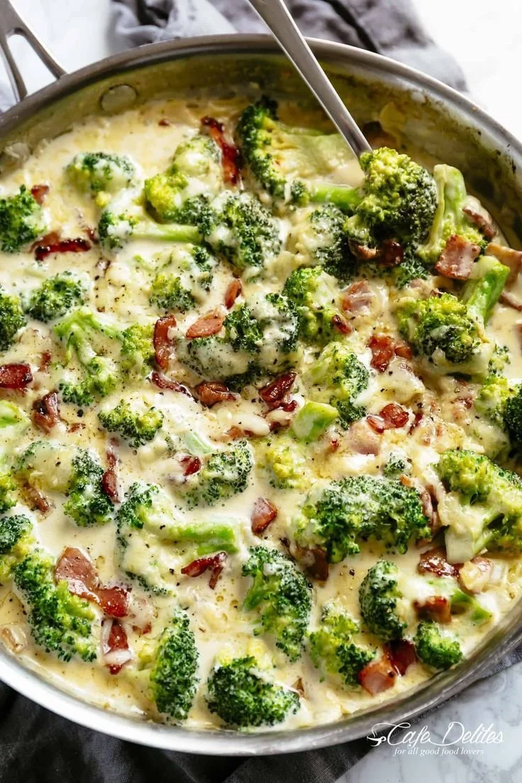 Creamy garlic parmesan broccoli with crispy bacon for a flavorful side dish