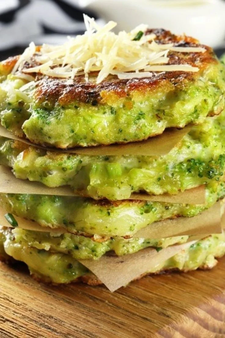 Delicious broccoli galettes served on a plate with fresh herbs.