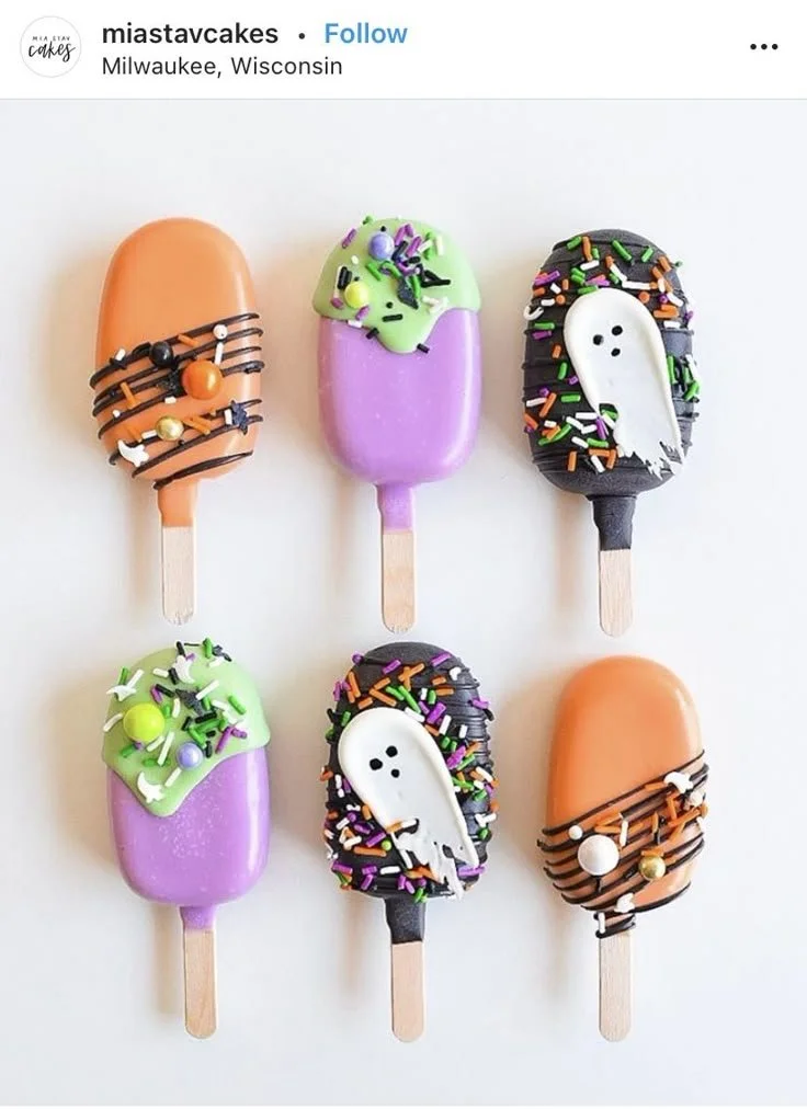 Variety of Halloween cakesicles artfully decorated for spooky celebrations.