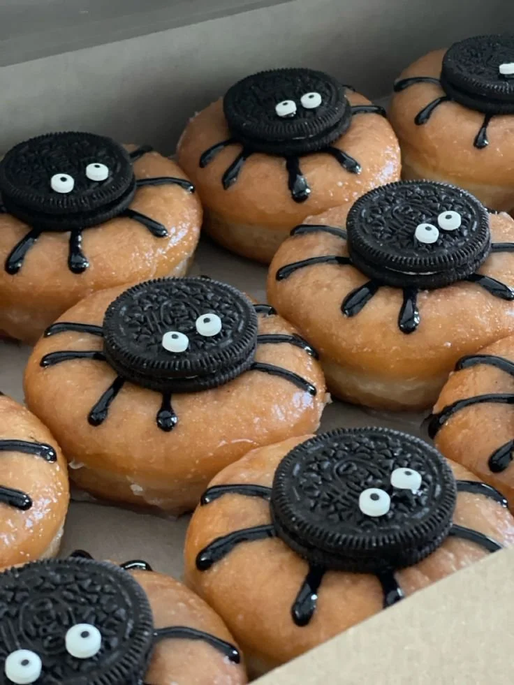 Halloween Oreo Spider Donuts with chocolate and spooky decorations
