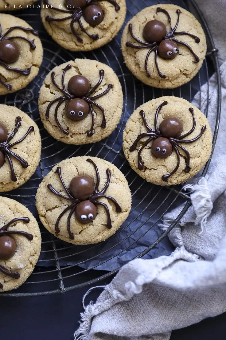 Peanut Butter Spider Cookies decorated with chocolate and candy on a plate