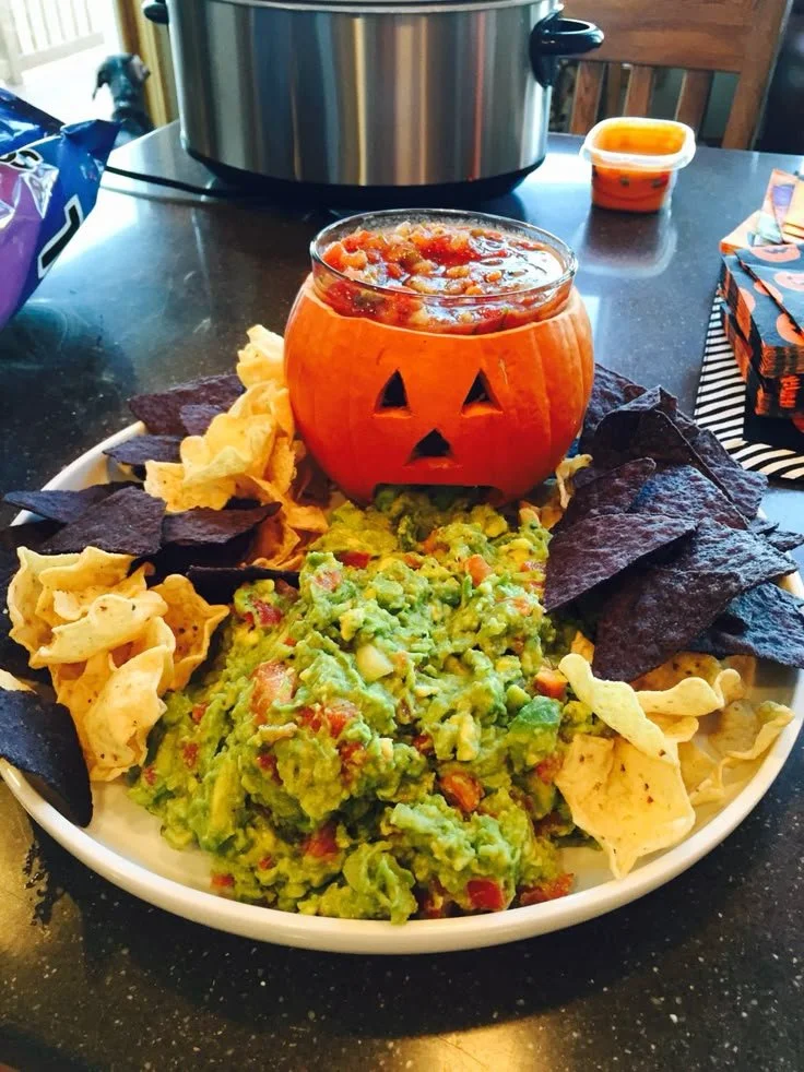 Creative puking pumpkin display for Halloween appetizers and party food
