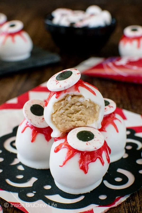 Halloween cake pops decorated as spooky peanut butter eyeballs