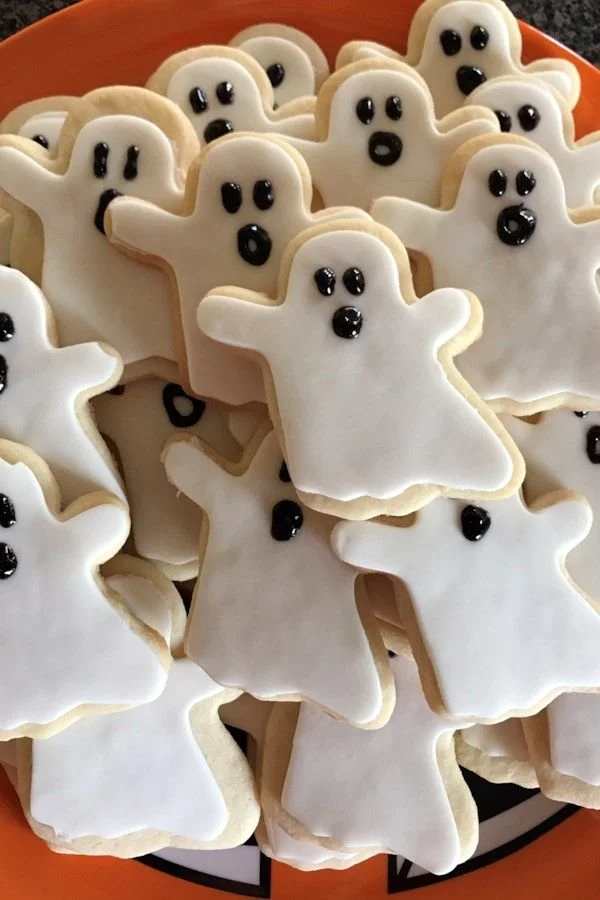 Freshly baked soft sugar cookies on a plate ready for Halloween festivities