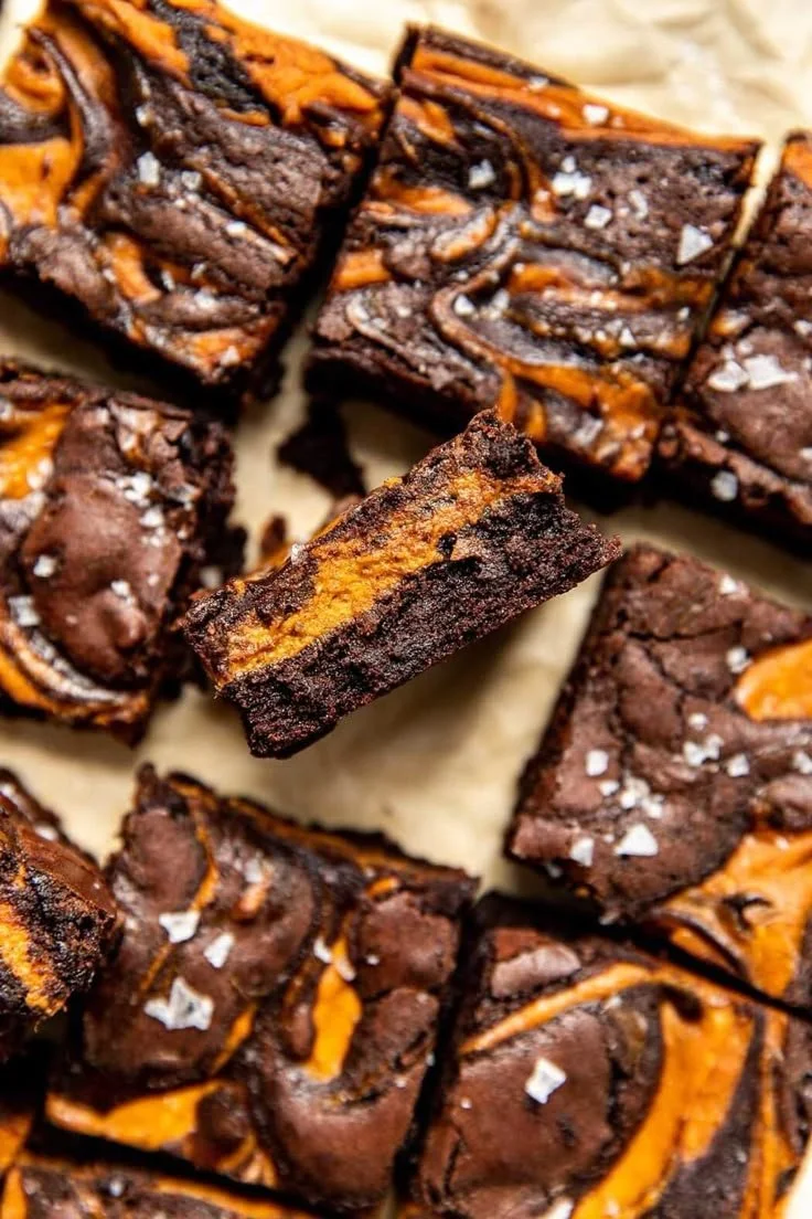 Delicious homemade pumpkin brownies on a wooden table